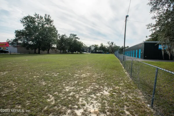 a view of a field with an outdoor space