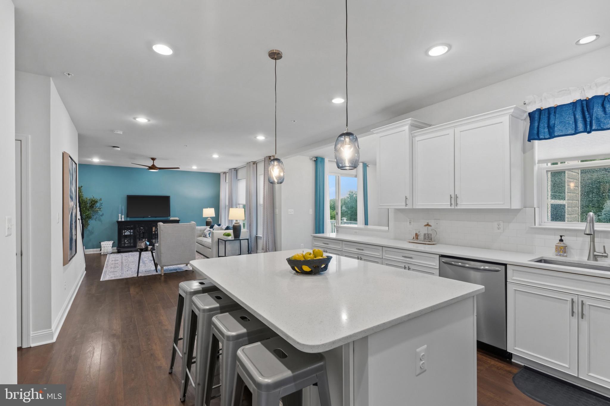 703 Perception Way Aberdeen, MD 21001 - Photo 7 of 42 a kitchen with a sink a counter space and appliances
