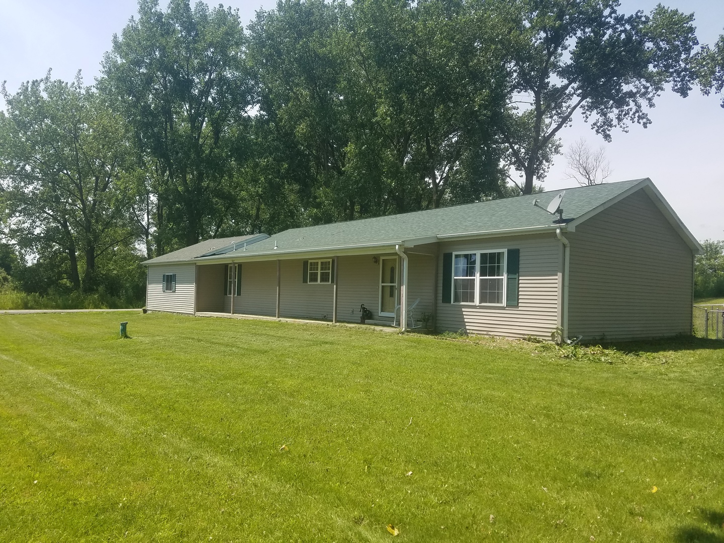25814 Mary Road Garden Prairie, IL 61038 - Photo 13 of 19 a house that has a big yard with large trees