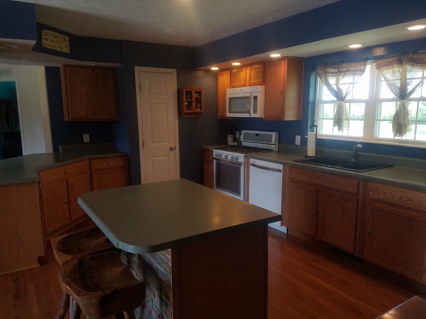 25814 Mary Road Garden Prairie, IL 61038 - Photo 5 of 19 a kitchen with a table chairs refrigerator and microwave
