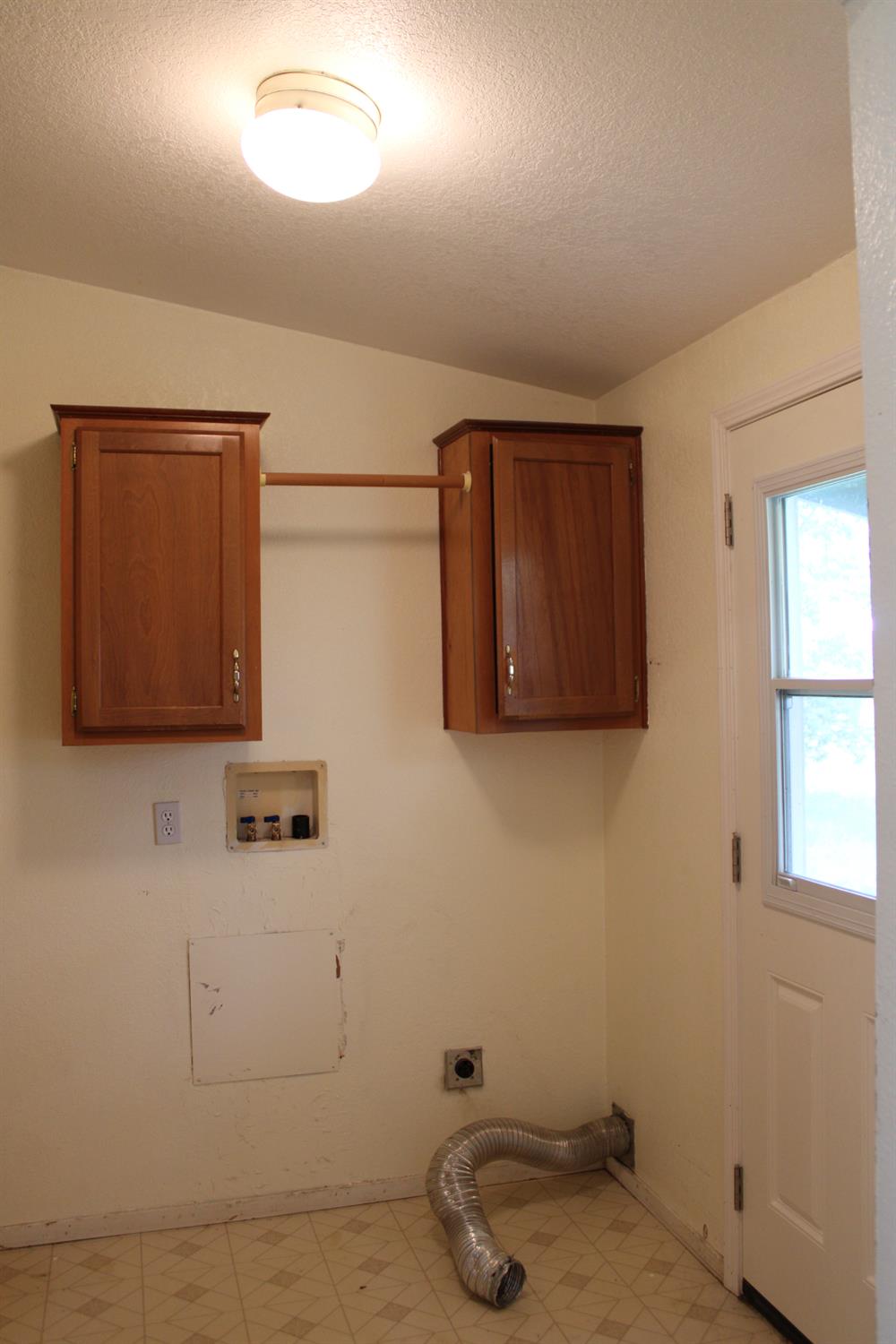 12245 Hobday Road Wilton, CA 95693 - Photo 15 of 20 Laundry Room with an exterior door to the back