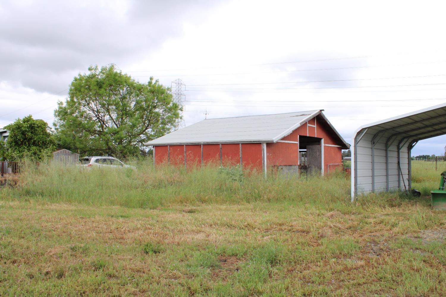 12245 Hobday Road Wilton, CA 95693 - Photo 15 of 16 Barn and open-ended metal building