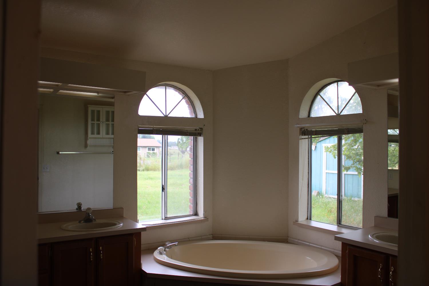 12245 Hobday Road Wilton, CA 95693 - Photo 7 of 16 Garden tub in Primary bath, showing both sinks