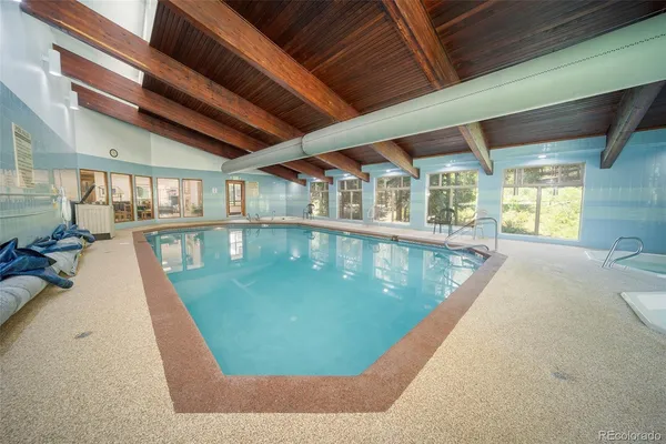 a view of a swimming pool with an outdoor seating