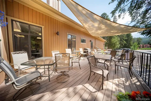 a view of a patio with table and chairs and potted plants