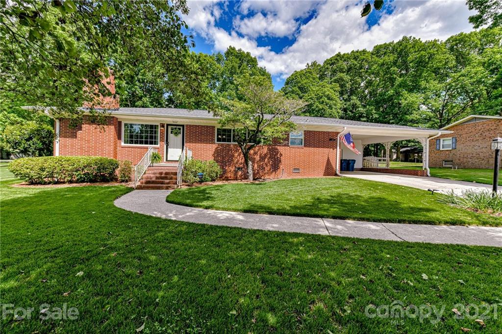 5662 Pagemont Road Kannapolis, NC 28081 - Photo 1 of 27 a front view of a house with a yard and trees