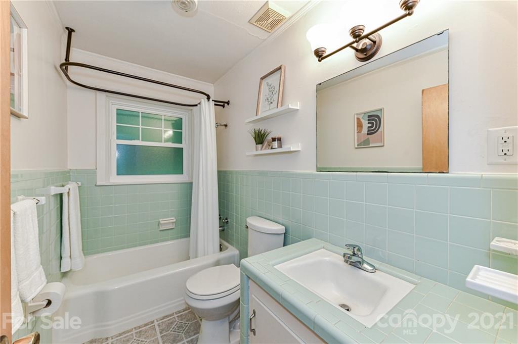 5662 Pagemont Road Kannapolis, NC 28081 - Photo 17 of 27 a bathroom with a sink toilet and shower