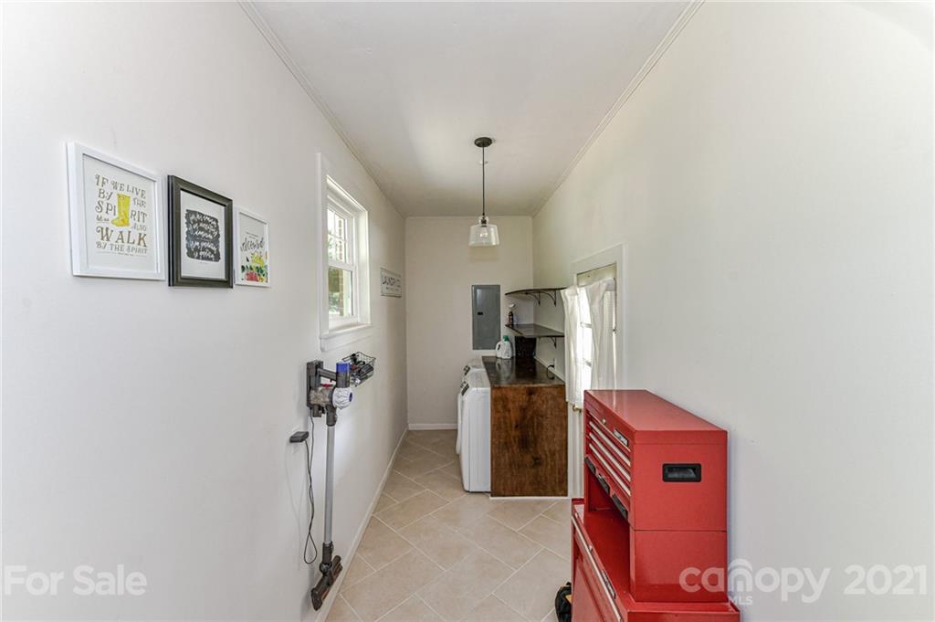 5662 Pagemont Road Kannapolis, NC 28081 - Photo 21 of 27 a view of a storage & utility room with a fridge