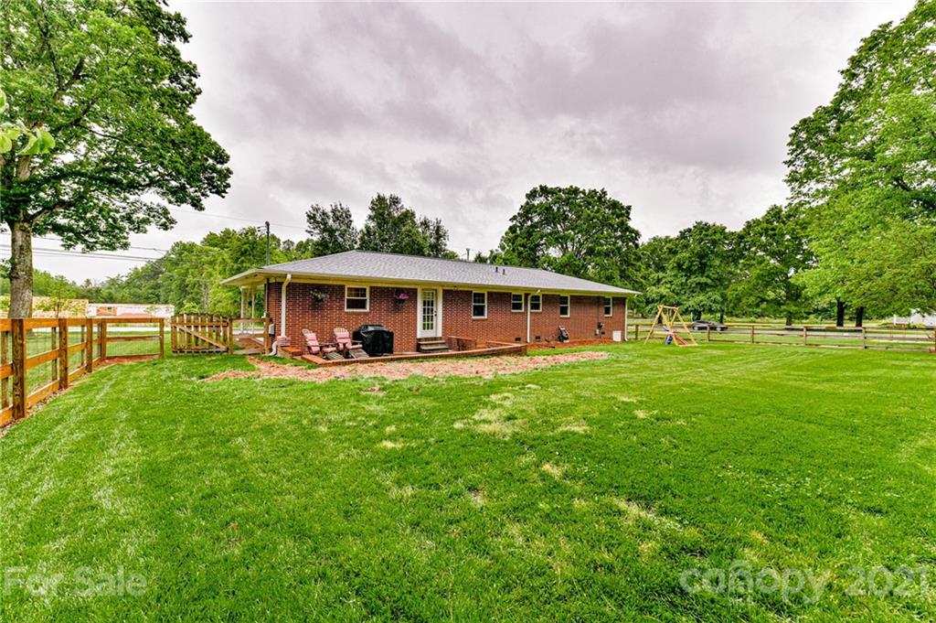 5662 Pagemont Road Kannapolis, NC 28081 - Photo 23 of 27 a view of a house with backyard and garden