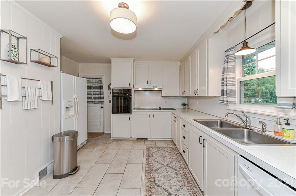 5662 Pagemont Road Kannapolis, NC 28081 - Photo 10 of 27 a kitchen with a sink cabinets and window