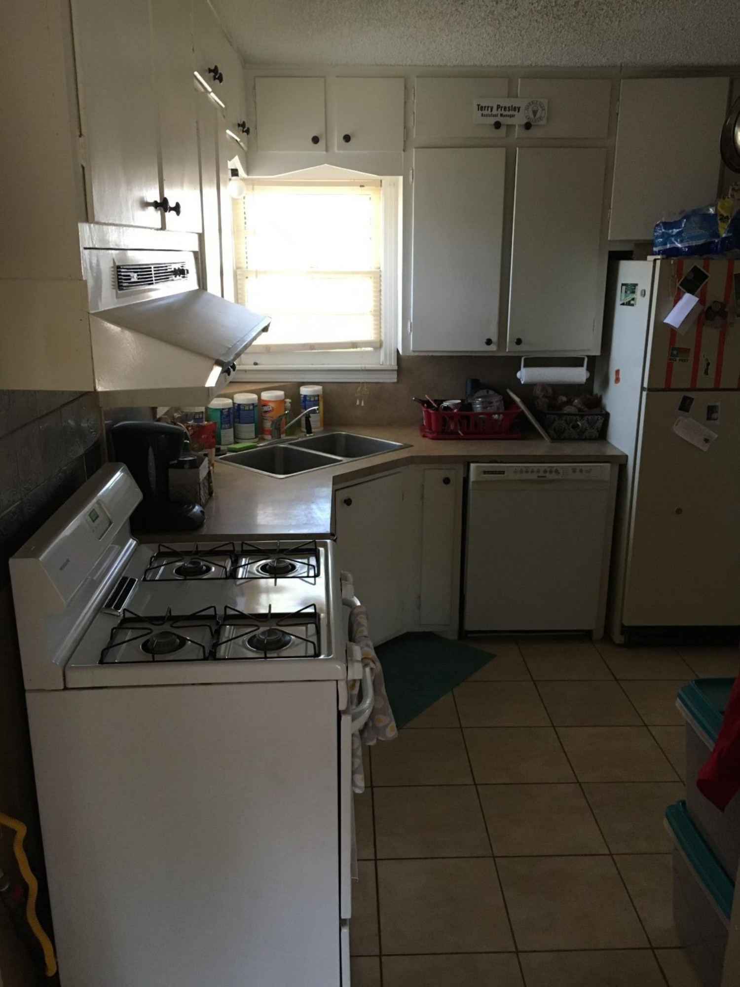 2617 37th Street Lubbock, TX 79413 - Photo 9 of 10 a kitchen with granite countertop a sink and a stove
