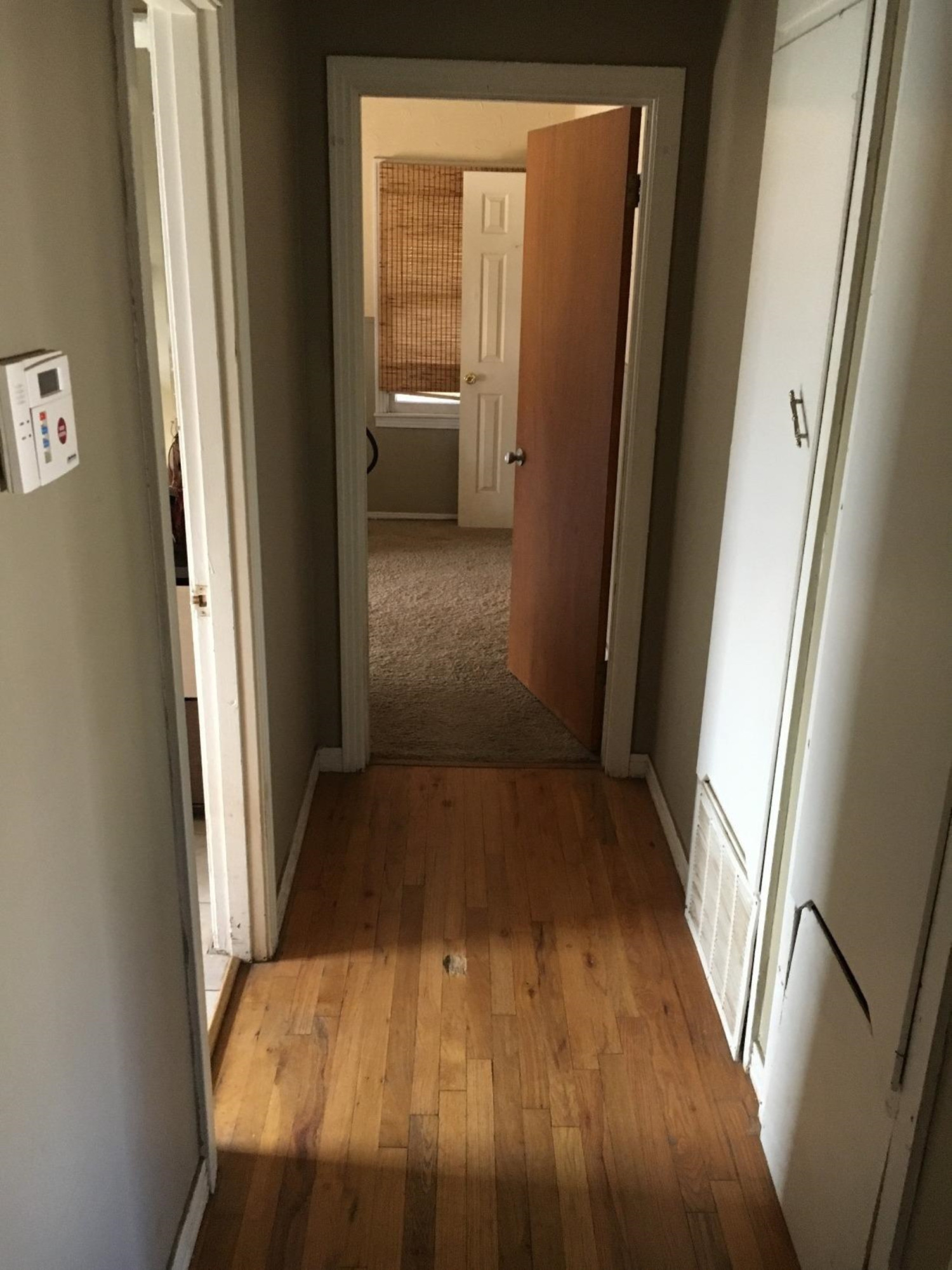 2617 37th Street Lubbock, TX 79413 - Photo 10 of 10 a view of a hallway with wooden floor and staircase