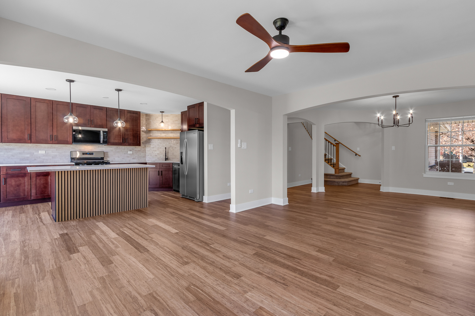 25653 Bridle Path Channahon, IL 60410 - Photo 11 of 43 a kitchen with stainless steel appliances a refrigerator sink and wooden floor