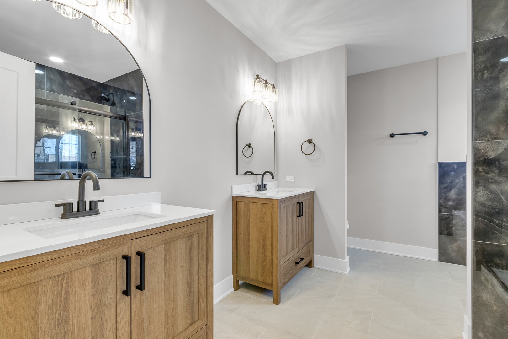 25653 Bridle Path Channahon, IL 60410 - Photo 18 of 43 a bathroom with a double vanity sink and a mirror