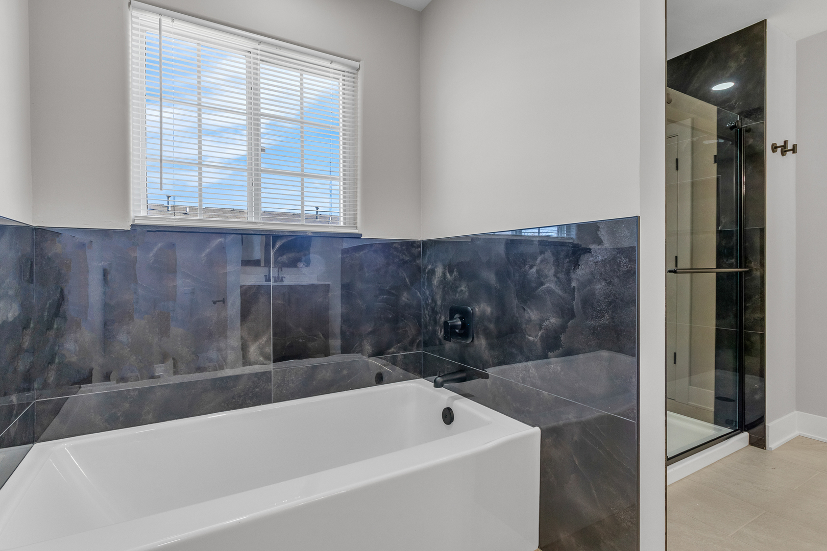 25653 Bridle Path Channahon, IL 60410 - Photo 20 of 43 a bathroom with a bathtub and window