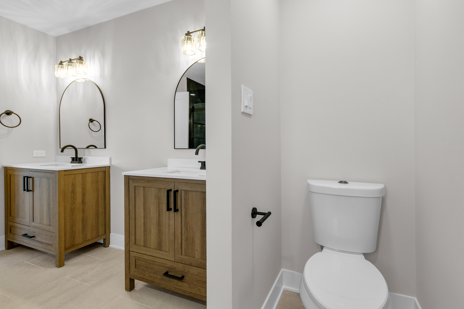 25653 Bridle Path Channahon, IL 60410 - Photo 21 of 43 a bathroom with 2 sink toilet and a mirror