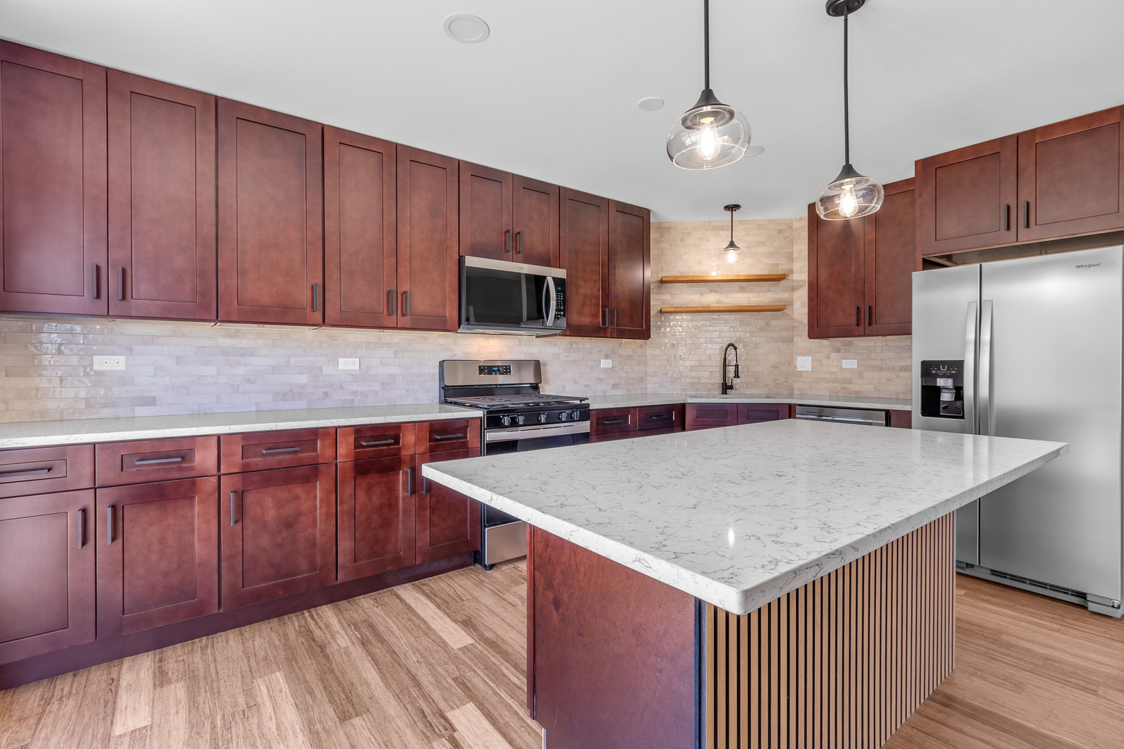 25653 Bridle Path Channahon, IL 60410 - Photo 4 of 43 a kitchen with stainless steel appliances granite countertop a sink microwave and refrigerator