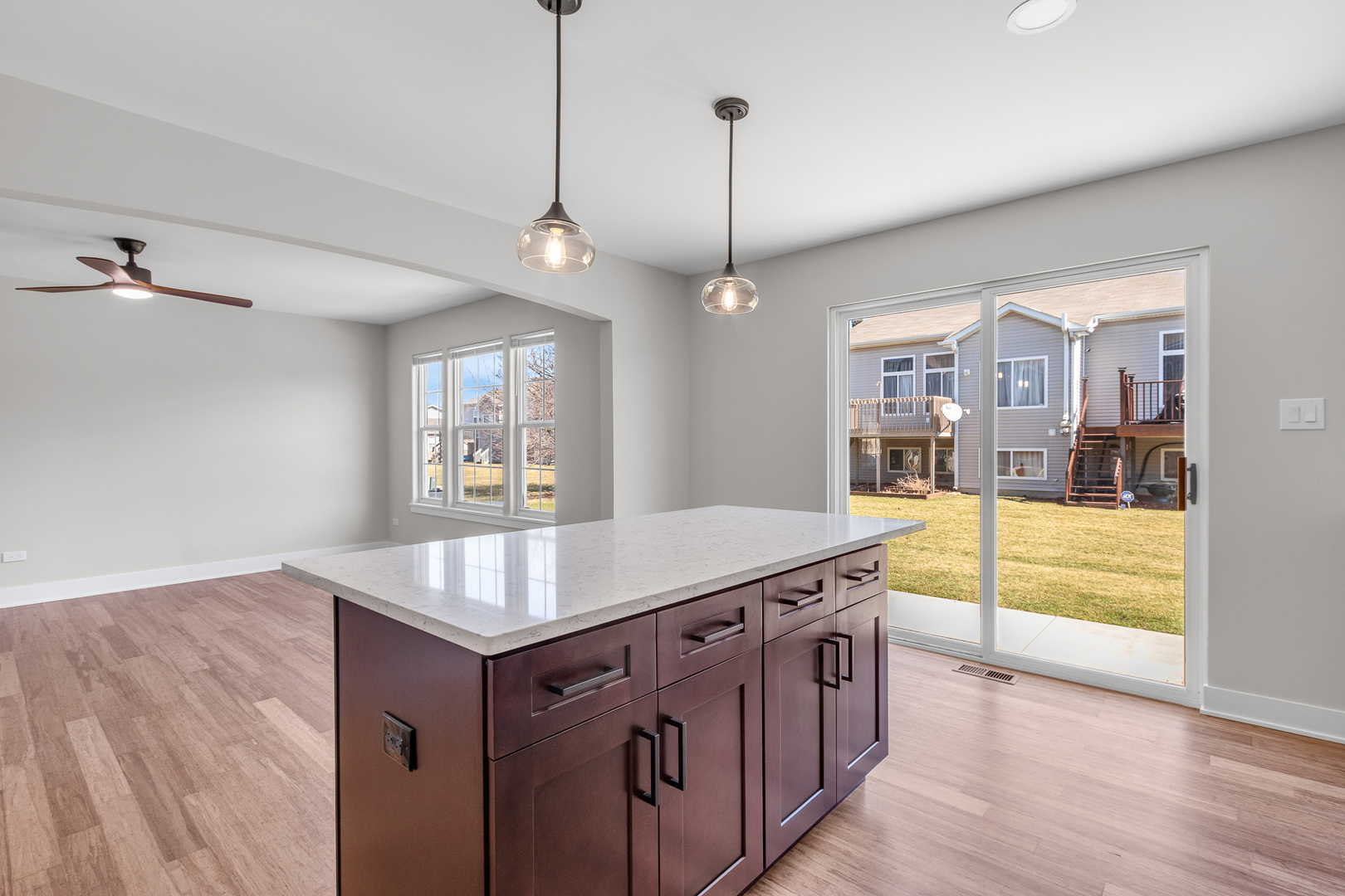 25653 Bridle Path Channahon, IL 60410 - Photo 5 of 43 a kitchen with stainless steel appliances granite countertop a sink a oven a counter space and wooden floor