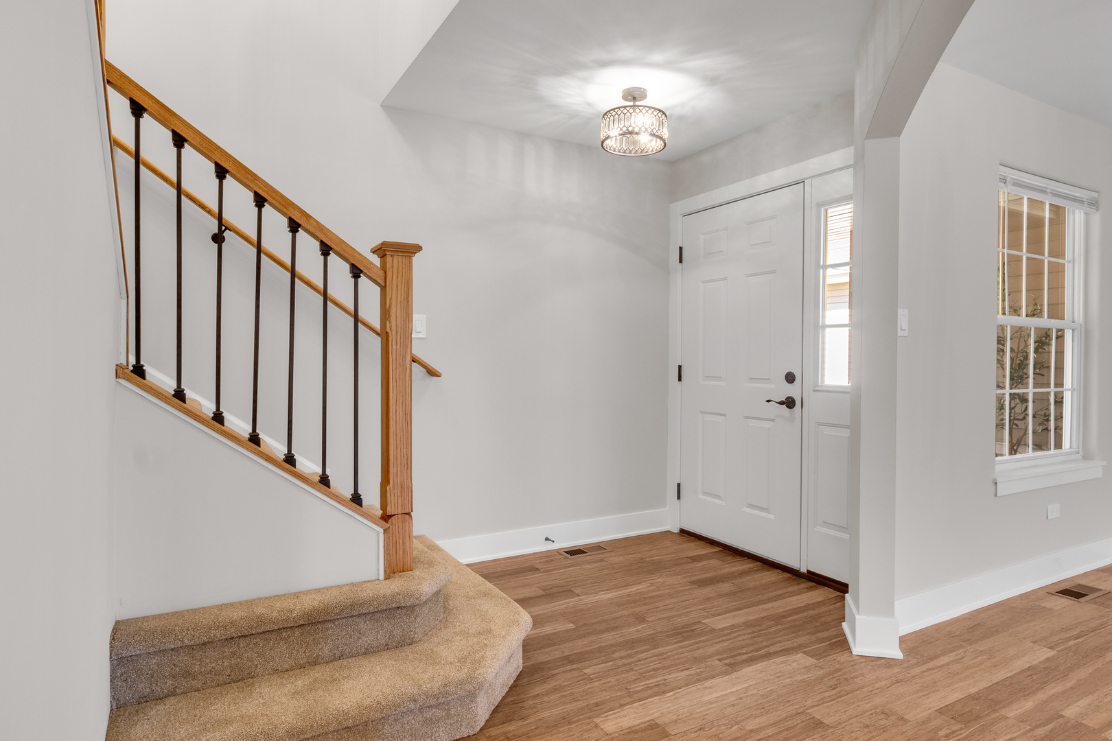25653 Bridle Path Channahon, IL 60410 - Photo 7 of 43 a view of entryway with stairs and wooden floor