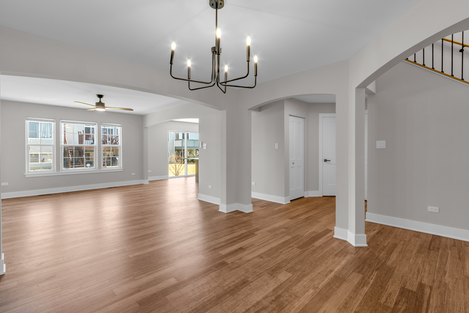 25653 Bridle Path Channahon, IL 60410 - Photo 9 of 43 a view of an empty room with wooden floor and a window