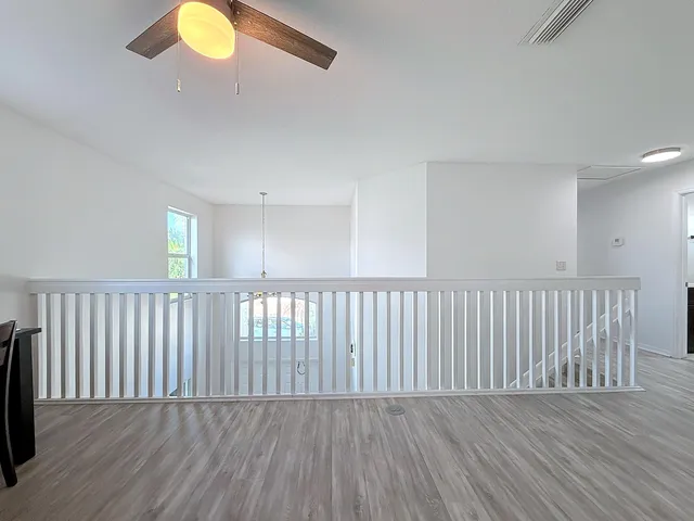 a bathroom with a sink vanity and mirror