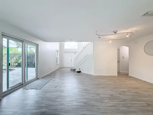 a view of livingroom with hardwood floor and stairs