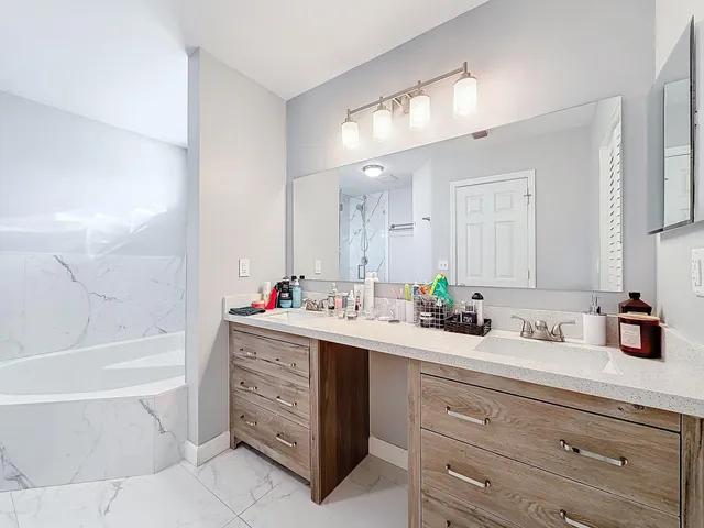 a view of a backyard with wooden fence