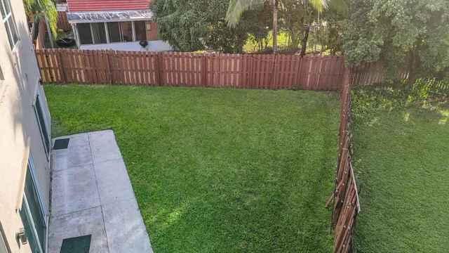 a view of a yard with a lake view