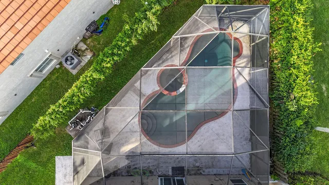 a view of a swimming pool with a patio