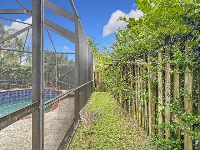 an aerial view of house with yard and outdoor seating