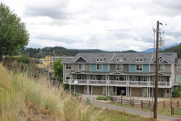 a view of a large building next to a lake
