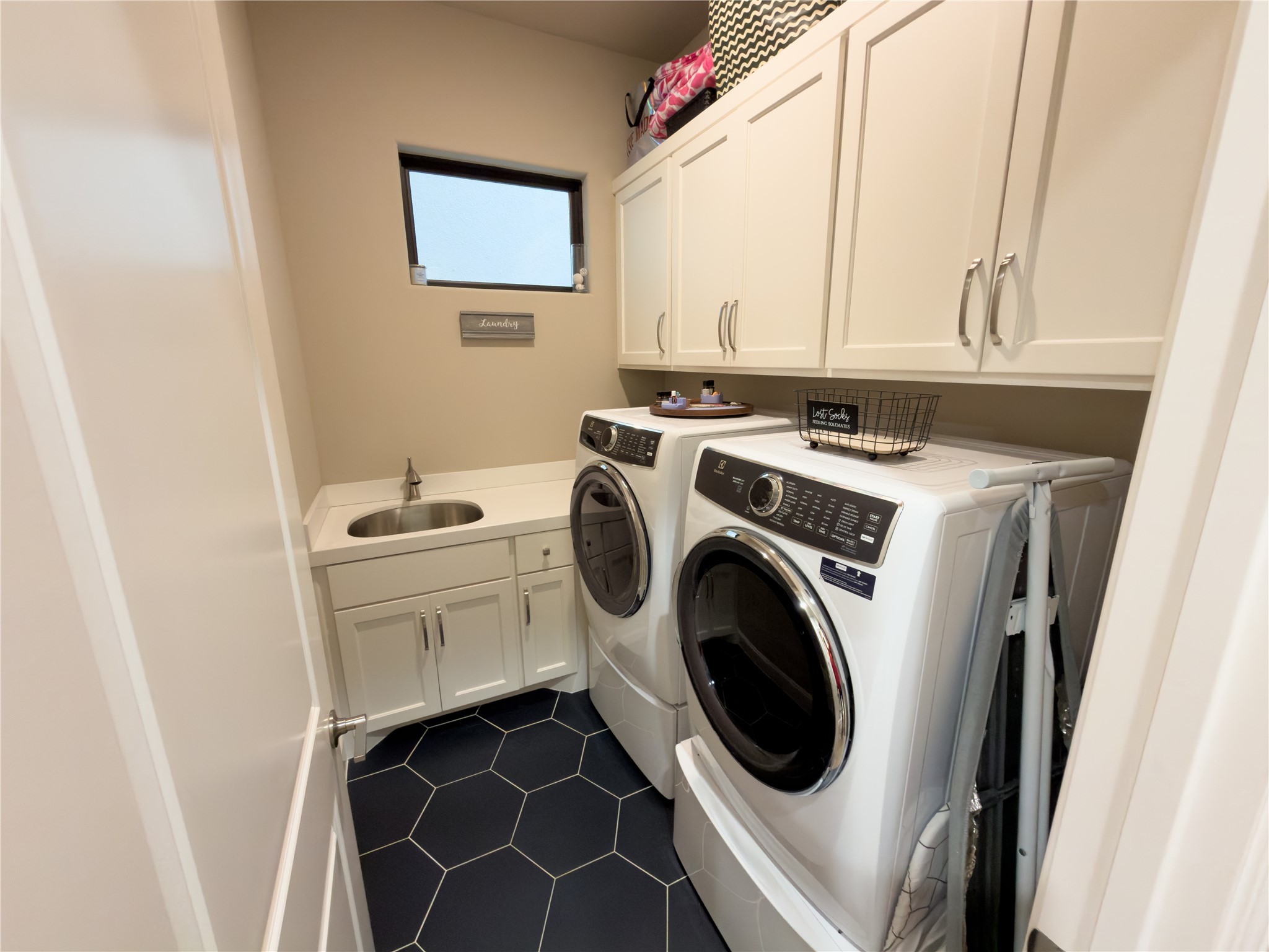2437 Prairie Hollow Lane Houston, TX 77077 - Photo 13 of 27 a utility room with dryer and washer