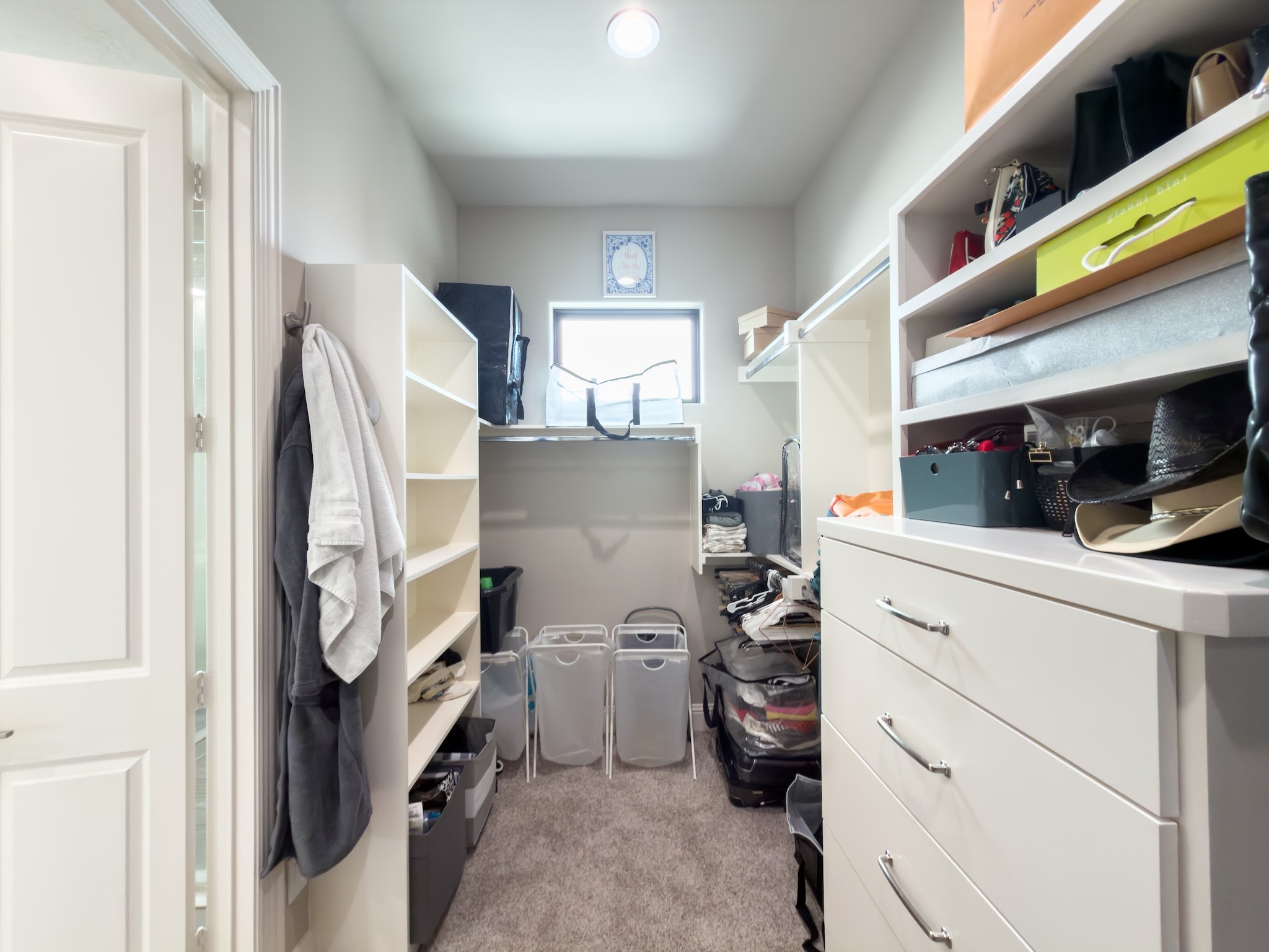 2437 Prairie Hollow Lane Houston, TX 77077 - Photo 19 of 27 a view of walk in closet with clothes and shoes