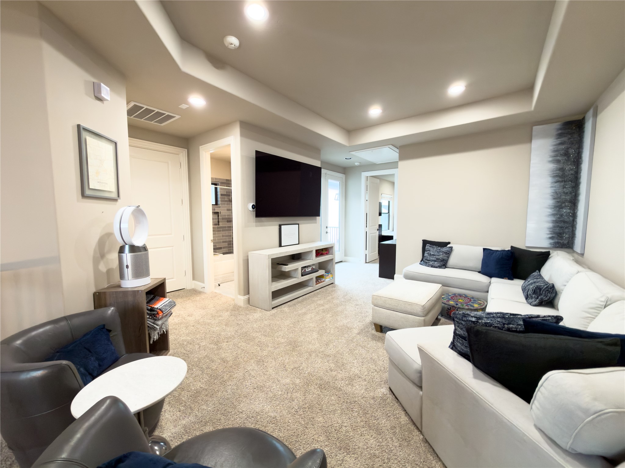 2437 Prairie Hollow Lane Houston, TX 77077 - Photo 20 of 27 a living room with furniture and a flat screen tv