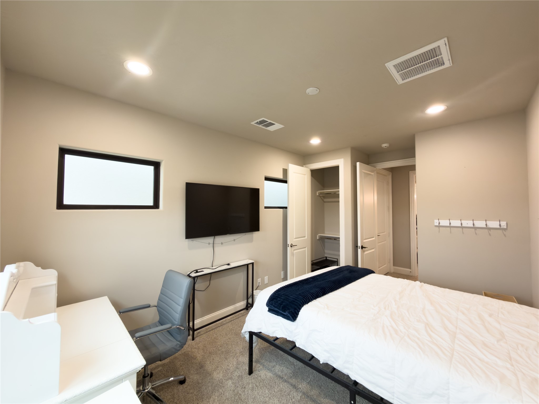 2437 Prairie Hollow Lane Houston, TX 77077 - Photo 22 of 27 a bedroom with a bed and a flat screen tv