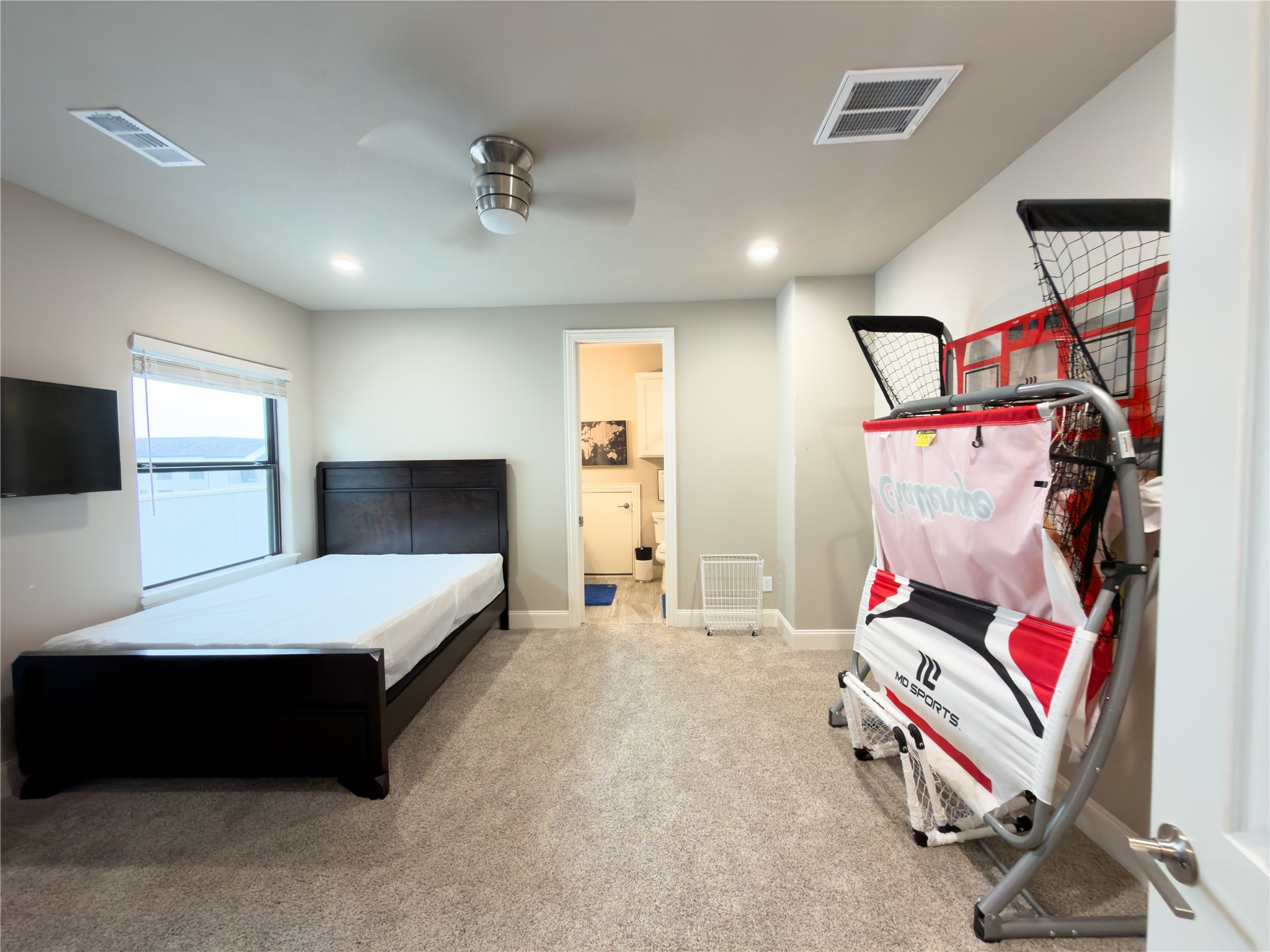 2437 Prairie Hollow Lane Houston, TX 77077 - Photo 25 of 27 a room with furniture and a flat screen tv