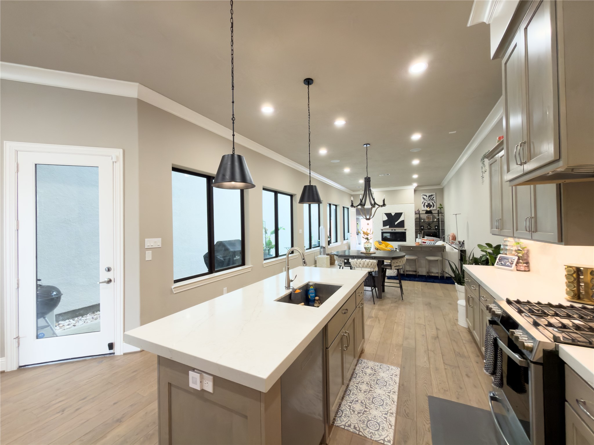2437 Prairie Hollow Lane Houston, TX 77077 - Photo 4 of 27 a kitchen with a stove a refrigerator and a sink