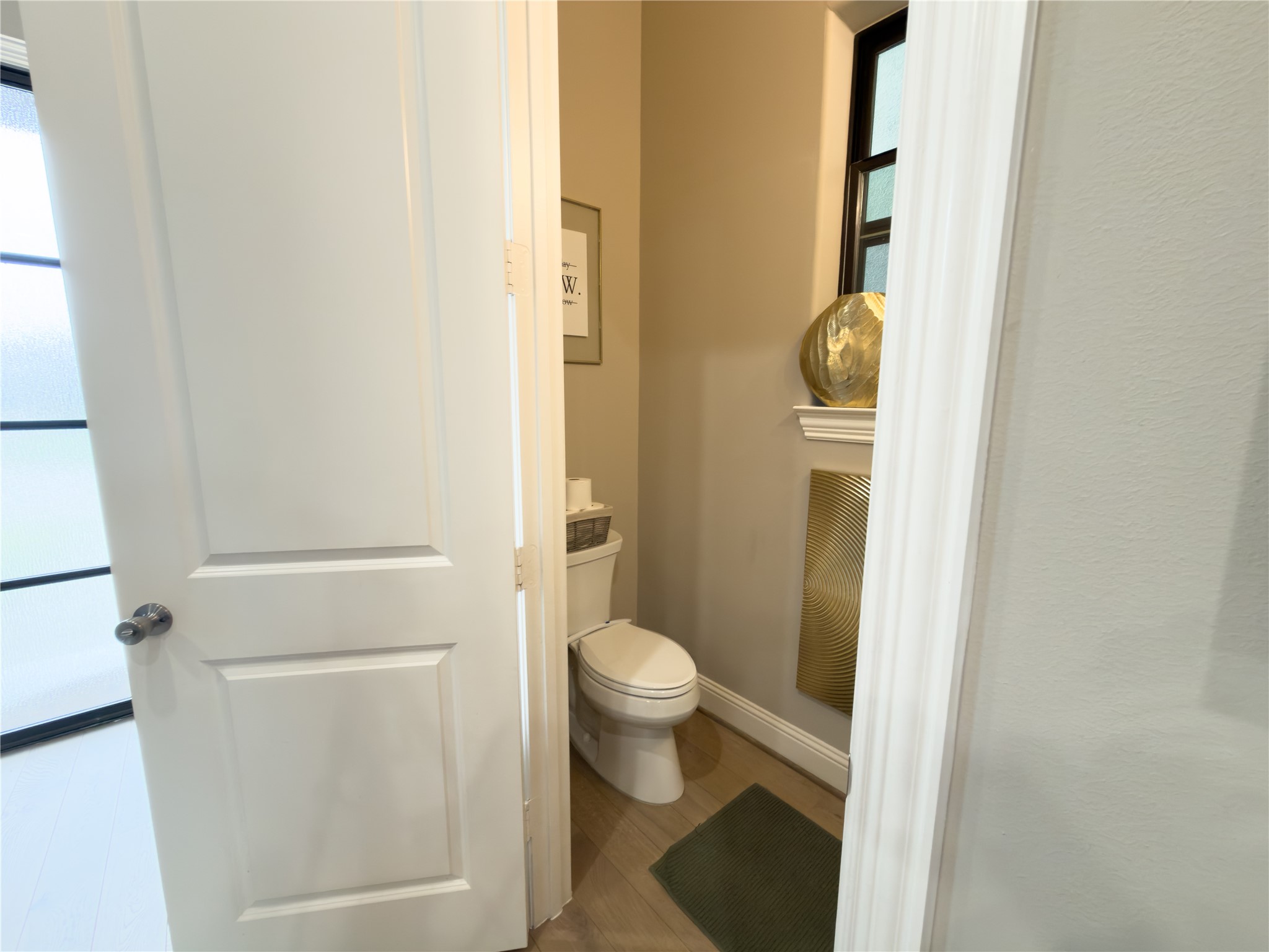 2437 Prairie Hollow Lane Houston, TX 77077 - Photo 9 of 27 a bathroom with a toilet and a sink