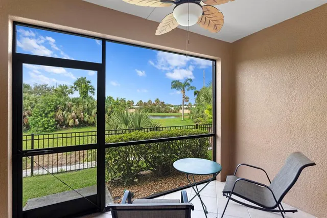 a view of a room with a table and chairs