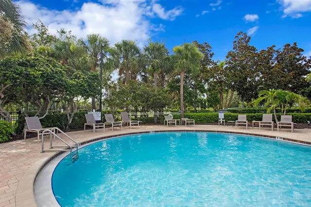a view of a swimming pool with a patio