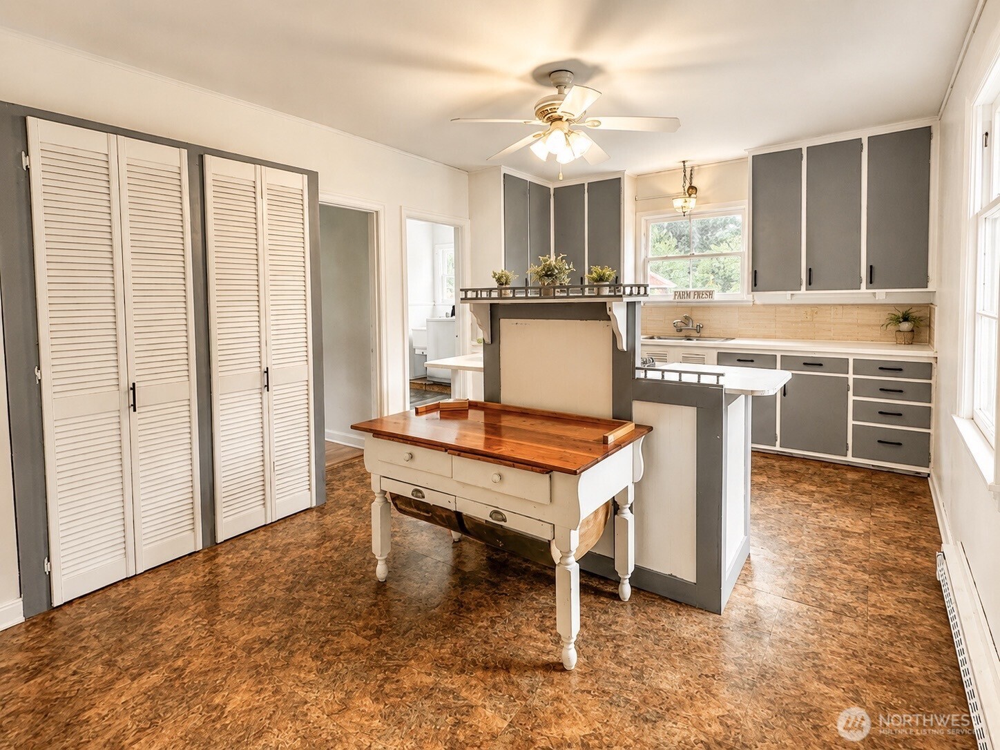 2154 Cranberry Road Grayland, WA 98547 - Photo 6 of 38 a living room with a table chairs and a kitchen view