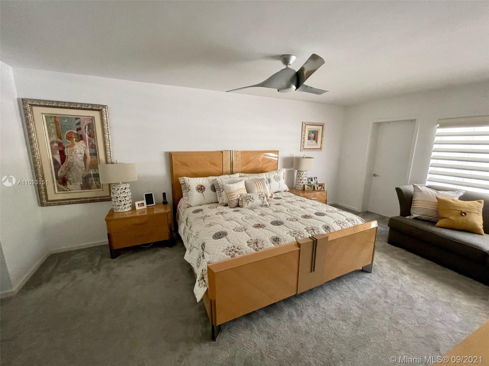19620 Planters Point Drive Boca Raton, FL 33434 - Photo 17 of 21 a bedroom with a bed couch and window
