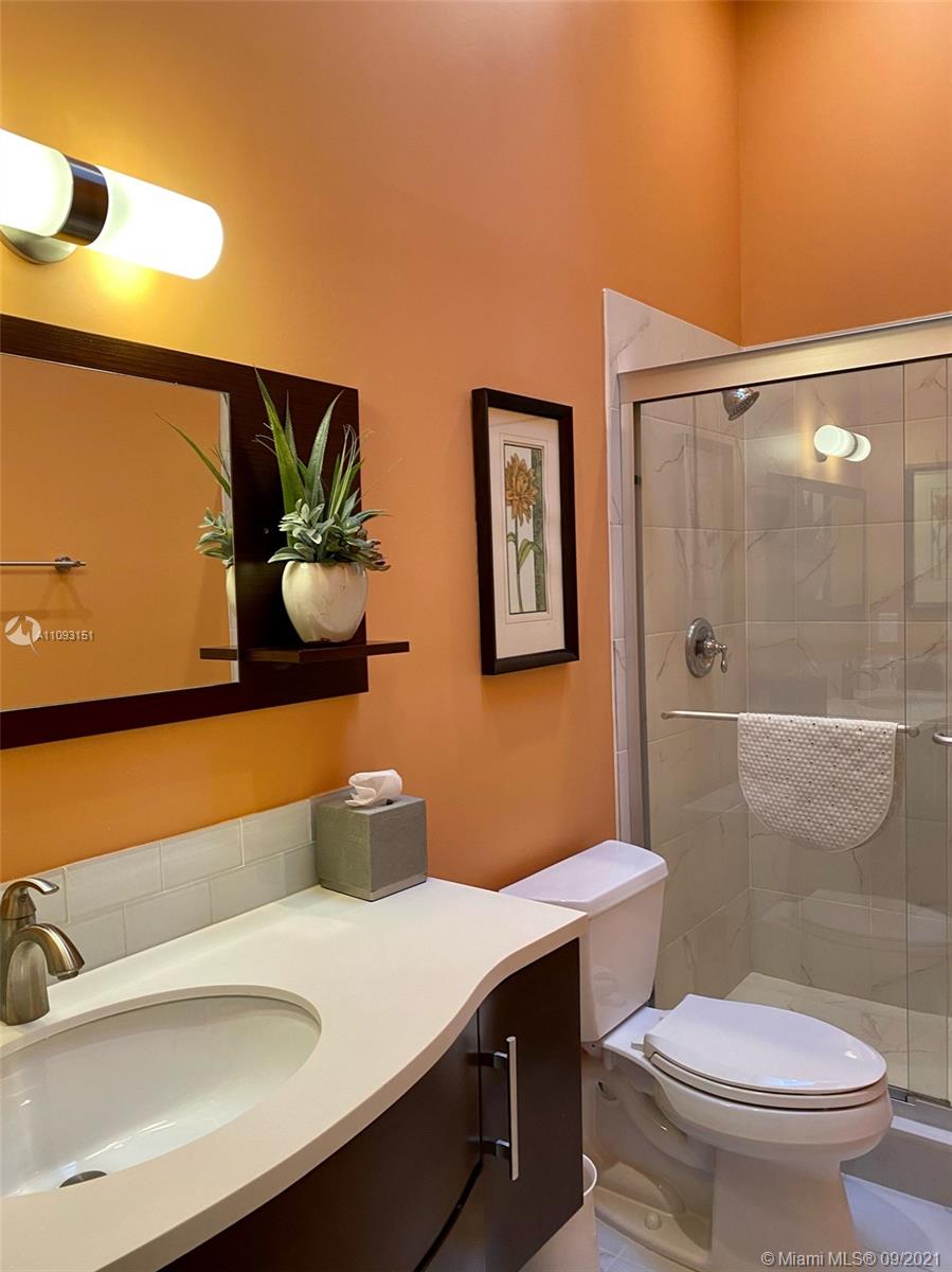 19620 Planters Point Drive Boca Raton, FL 33434 - Photo 19 of 21 a bathroom with a sink a toilet and shower