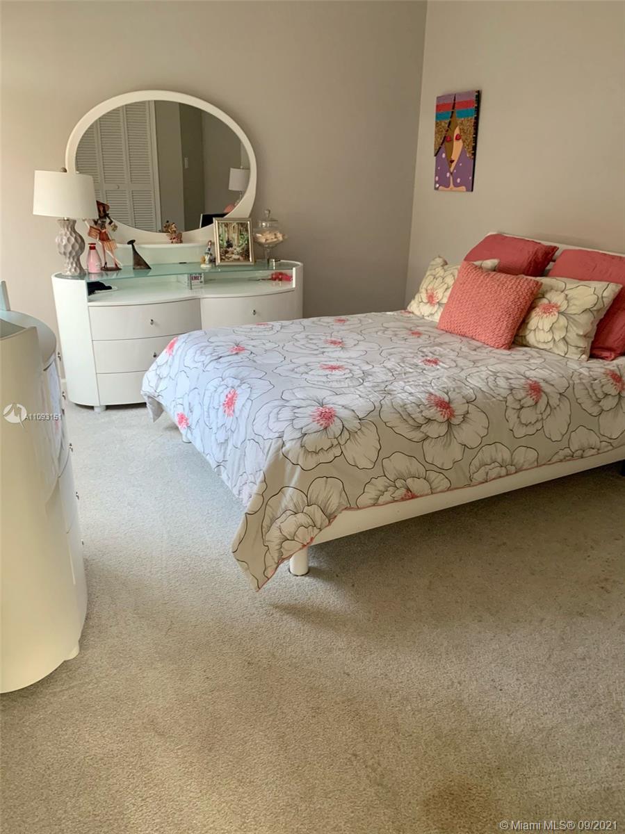 19620 Planters Point Drive Boca Raton, FL 33434 - Photo 20 of 21 a bedroom with a bed and a mirror