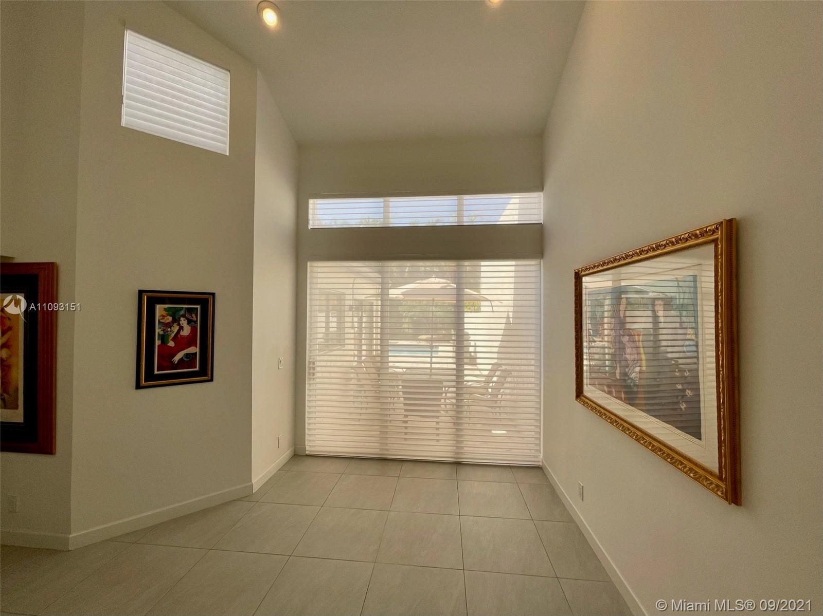 19620 Planters Point Drive Boca Raton, FL 33434 - Photo 5 of 21 a view of an empty room with glass door