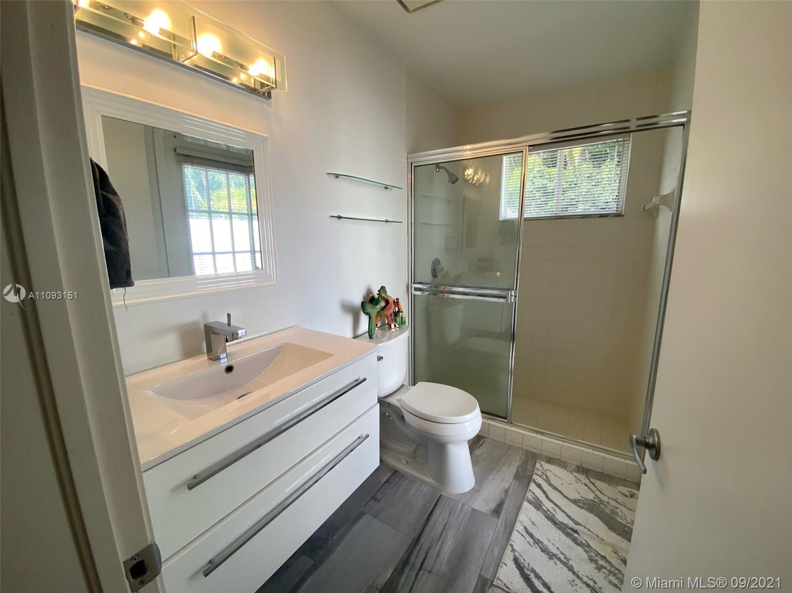19620 Planters Point Drive Boca Raton, FL 33434 - Photo 8 of 21 a bathroom with a sink toilet and shower
