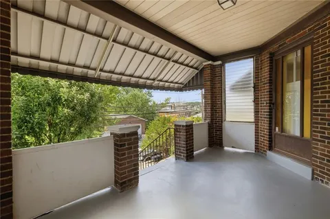 a view of a porch with furniture