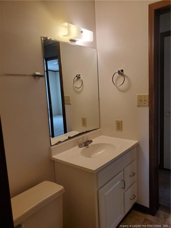 50 Old Forte Trail Spring Lake, NC 28390 - Photo 19 of 20 a bathroom with a sink and mirror with toilet
