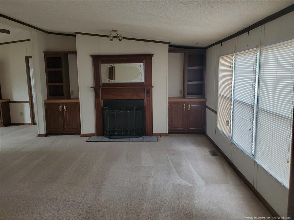 50 Old Forte Trail Spring Lake, NC 28390 - Photo 2 of 20 a view of an empty room with a fireplace