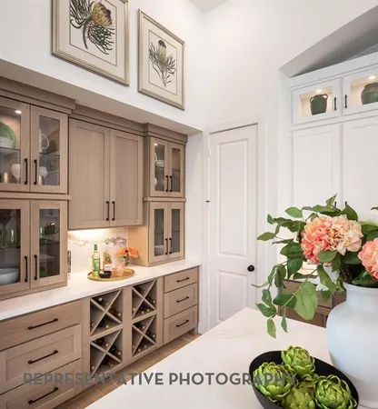 a kitchen with stainless steel appliances kitchen island granite countertop a sink a stove and cabinets